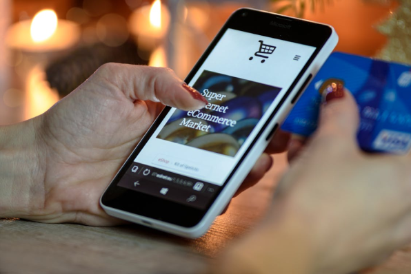 Person shopping on an eCommerce business on their cell phone.